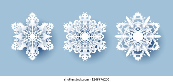 Vector set of 3 white Christmas paper cut 3d snowflakes with shadow on white background. New year and Christmas design elements