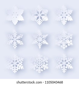 Vector set of 9 paper cut snowflakes with shadow on white background. New year and Christmas design elements