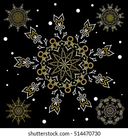 Vector set of abstract hand drawn yellow snowflakes maked on a black background. Hand painted sketch.