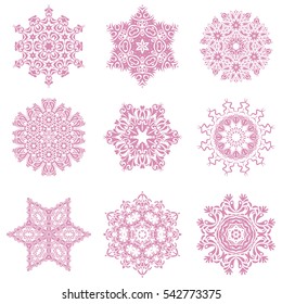 Vector set of abstract hand drawn pink snowflakes maked on a white background. Hand painted sketch.