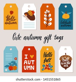 Vector set of autumn gift tags with hedgehog, pumpkin, acorn and hant written phrases about autumn. Printable gift labels for fall season. Cute cartoon character and plants. Journaling tags template.