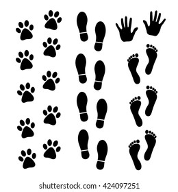 Vector set of black footprints of humans and animals.