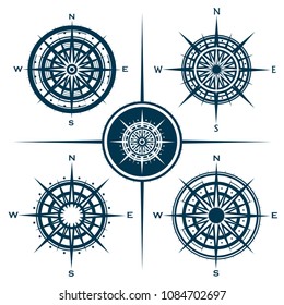 Vector set of blue isolated compass roses. Collection of different wind roses for graphic design. Vector illustration.