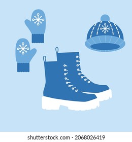 vector set of boots, mittens and hats. flat image of a set for walking in cold weather. Warm boots with knitted hat and mittens