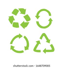 Vector set bundle of four different hand drawn doodle sketch green recycle symbol isolated on white background