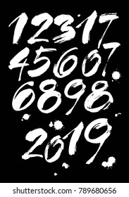 vector set of calligraphic acrylic or ink numbers. ABC for your design, brush lettering on a black background with blots