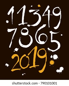 vector set of calligraphic acrylic or ink numbers. ABC for your design, brush lettering on a black background with blots
