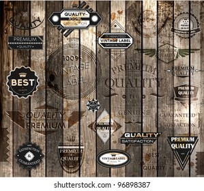 vector set of calligraphic design elements, page decoration, Premium Quality and Satisfaction Guarantee Label collection, Vintage wood background