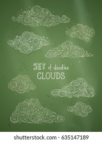 Vector set of chalk clouds on green blackboard background. Hand-drawn doodles swirls, scribbles, spirals, curls and patterns.