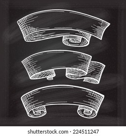 Vector set of chalk doodle scrolls and ribbons on the chalkboard background