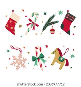 Conjunto vectorial de decoración navideña de estilo plano. Navidad elegante conjunto de calcetines de Navidad, juguetes, caramelos, copos de nieve, rama de árbol de piel, estrellas y confeti. Decoración de Año Nuevo.