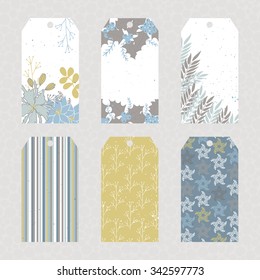 Vector set of Christmas floral tags. Winter label cards in pastel colors. For Christmas and New Year greeting cards, invitations, gifts decoration, sales design, scrapbooking and other.