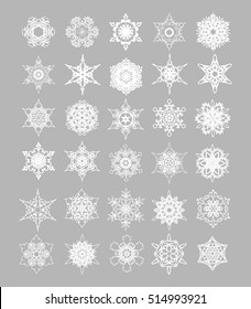 Vector set of Christmas lace snowflakes icons on gray background.