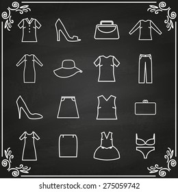 Vector set of clothes icons on chalkboard. Line style.