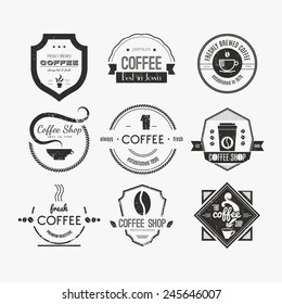 Vector set of coffee shop logos, restaurant or bar logotype design elements with mugs and beans. Ribbons, circle shapes, lables, insignias with coffee related elements. 