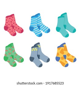 Vector set of colored bright pairs of socks. Socks with different patterns. White isolated background

