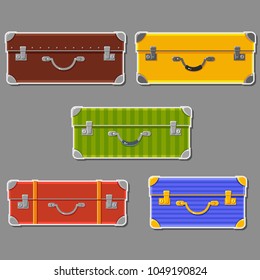 Vector set of colorful cases. Travelling. Summer holidays. Bright baggage. Cute cartoon laggage stickers on a gray background. Tourist elements.