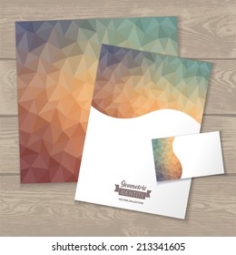 Vector set of corporate identity elements with geometric pattern. Templates (blank, card, wallpaper) for brand design on wood background.