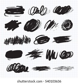 Vector set of dark blots on the white background. Scribble stains. Charcoal chalk texture. On a sheet of exercise book. Vector illustration
