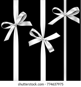 Vector set of decorative silver bows with vertical ribbon isolated on black. White bow for gift decor