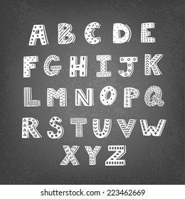 Vector set of different chalk letters on the blackboard. Stylish ABC. Retro hand drawing font.