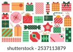 Vector set of different colorful Christmas gift boxes isolated on white background. Modern mid century clip art of present boxes in red, green, pink and gold colors.