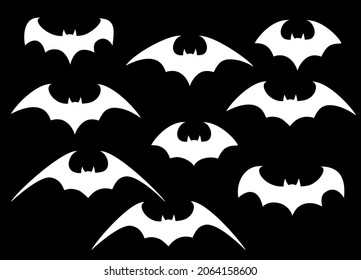 Vector set of different Halloween bats. Halloween flying bats. Vampire vector bat. Dark silhouette of bat flying in a flat style