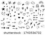 Vector set of different stars, sparkles, arrows, hearts, diamonds, signs and symbols. Hand drawn, doodle elements isolated on white background