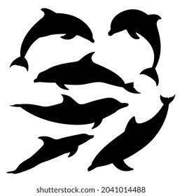 Conjunto vectorial de siluetas delfines sobre fondo blanco