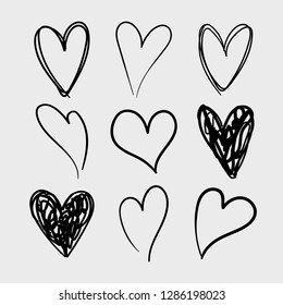 Vector set of doodle hand drawn isolated hearts icons. Design elements