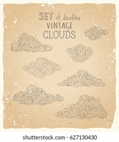 Vector set of doodles vintage clouds. Linear clouds on old paper background. Hand-drawn swirls, scribbles, spirals, curls and patterns.