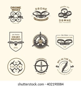 Vector set of drone flying club labels, badges and design elements. Smart drone festival emblem. Drone shop advertising. Monochrome silhouettes of drones and drone blades. Vintage illustration.