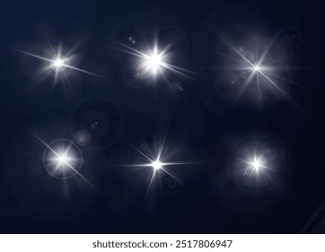 A vector set of flash effects with bright white rays on a black background. An illustration with a bright spark of energy for a design with magical elements