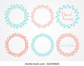 Vector set of floral hand drawn round frames. In red and blue colors.