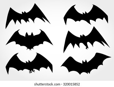 Vector set of flying black silhouettes of bats