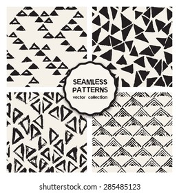 Vector set of four seamless patterns. Stylish collection with tileable swatches. Monochrome prints, backgrounds made with brush strokes: triple chevron, hipster triangles