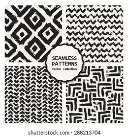 Vector set of four seamless patterns. Stylish collection with tileable swatches. Monochrome prints, backgrounds made with brush strokes: triple chevron, hipster triangles