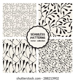 Vector set of four seamless patterns. Floral repeating backgrounds. Stylish collection of floral swatches. Randomly disposed branches. Thin monochrome leaves. Modern graphic design.