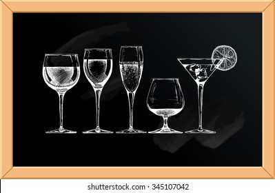 Vector set of glasses goblets on chalkboard background.