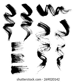 Vector set of grunge brush strokes. Black mascara brush strokes set. Black paint spots vector set