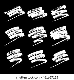 Vector set of grunge brush strokes. White vector brush in a black background. Strokes collection. Grunge stains. Set of brushes design elements, hand drawn with ink.