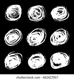 Vector set of grunge brush strokes. White vector brush in a black background. Strokes collection. Grunge stains. Set of brushes design elements, hand drawn with ink.