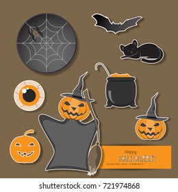 Vector set of Halloween objects cut from paper on the brown background with shadow.