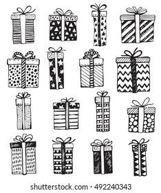 Vector set of hand drawn Christmas or birthday ornate present boxes isolated on white background. Illustration in graphic doodle style