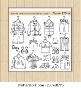 Vector set of hand drawn doodles of boys clothes on white background. Sketches for use in design