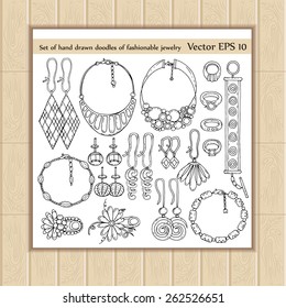 Vector set with hand drawn doodles of fashionable jewelry on white background. Sketches for use in design