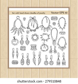 Vector set with hand drawn doodles of fashionable jewelry on white background. Sketches for use in design