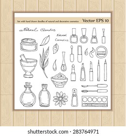 Vector set with hand drawn doodles of natural and decorative cosmetics on white background. Sketches for use in design