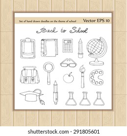 Vector set with hand drawn doodles on the theme of school with school symbols on white background. Sketches for use in design
