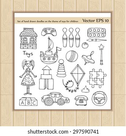 Vector set of hand drawn doodles on the theme of toys for children. Sketches for use in design. Illustrations of dolls, pyramids, towers, whirligig, ship, pins, paint, car, kite